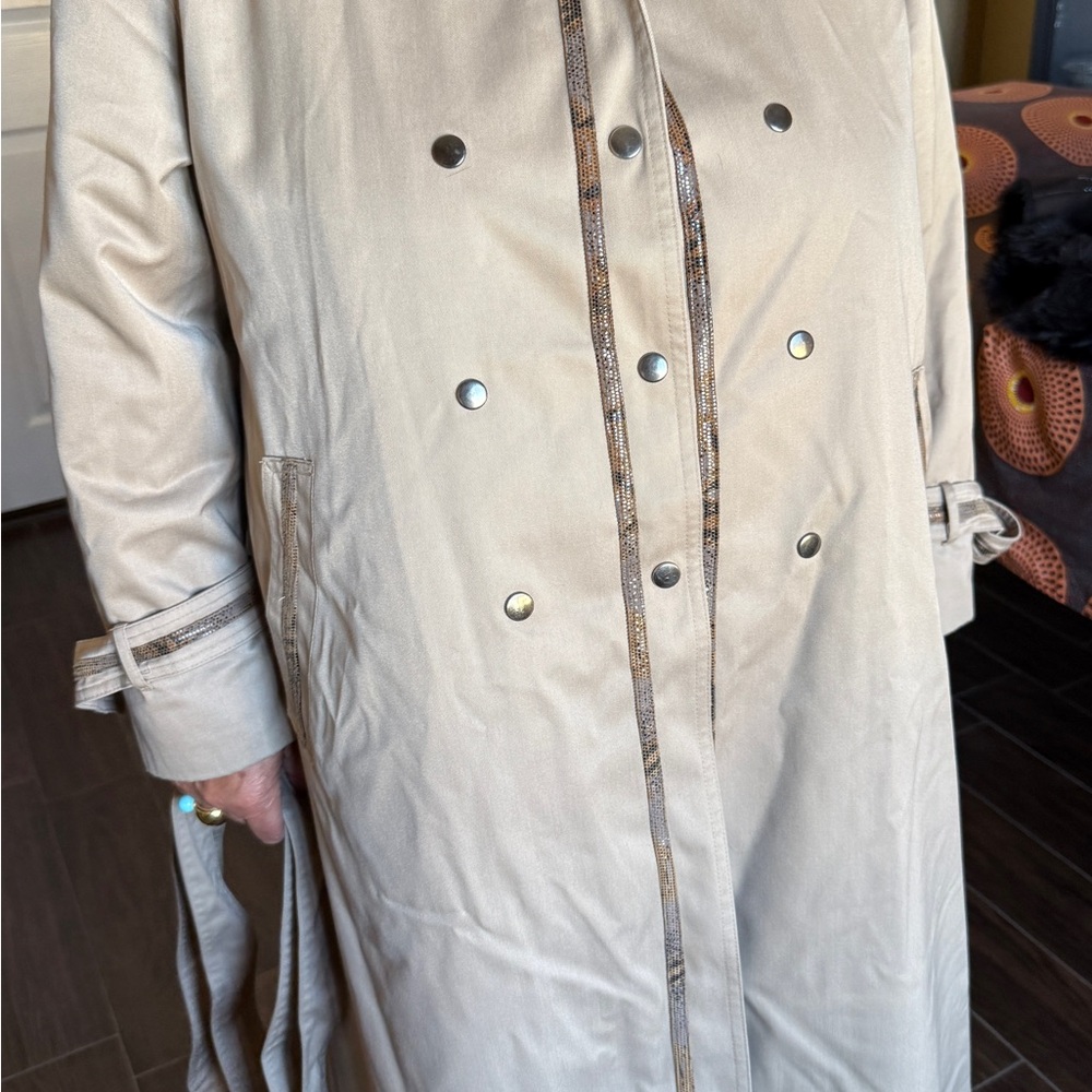Elegant vintage beige women’s trench coat.